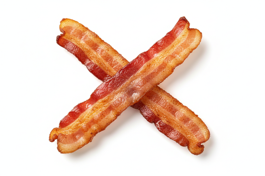 2 slices of bacon crossed white background